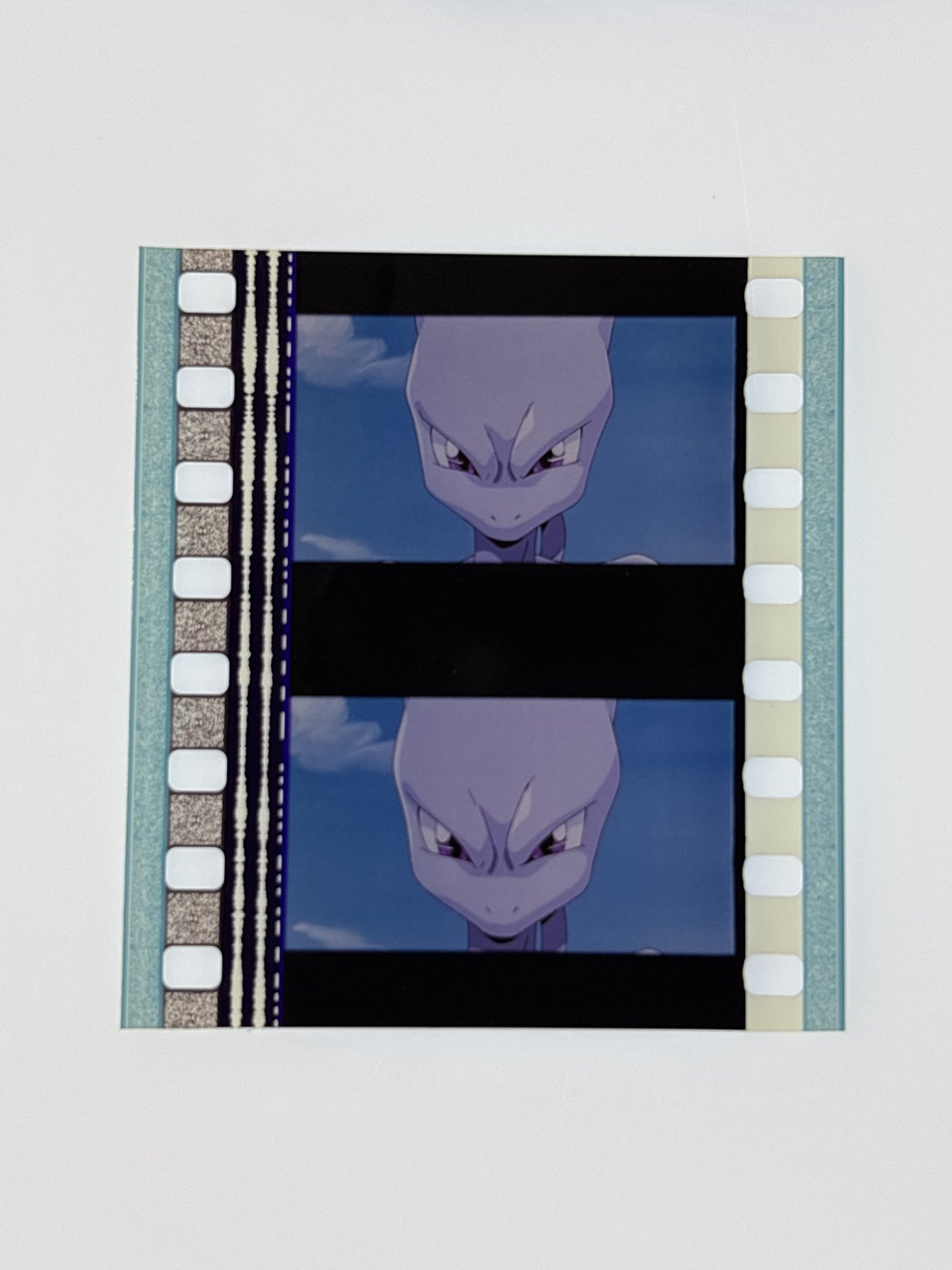 The film strip as photographed on the light panel at intake, before encapsulation