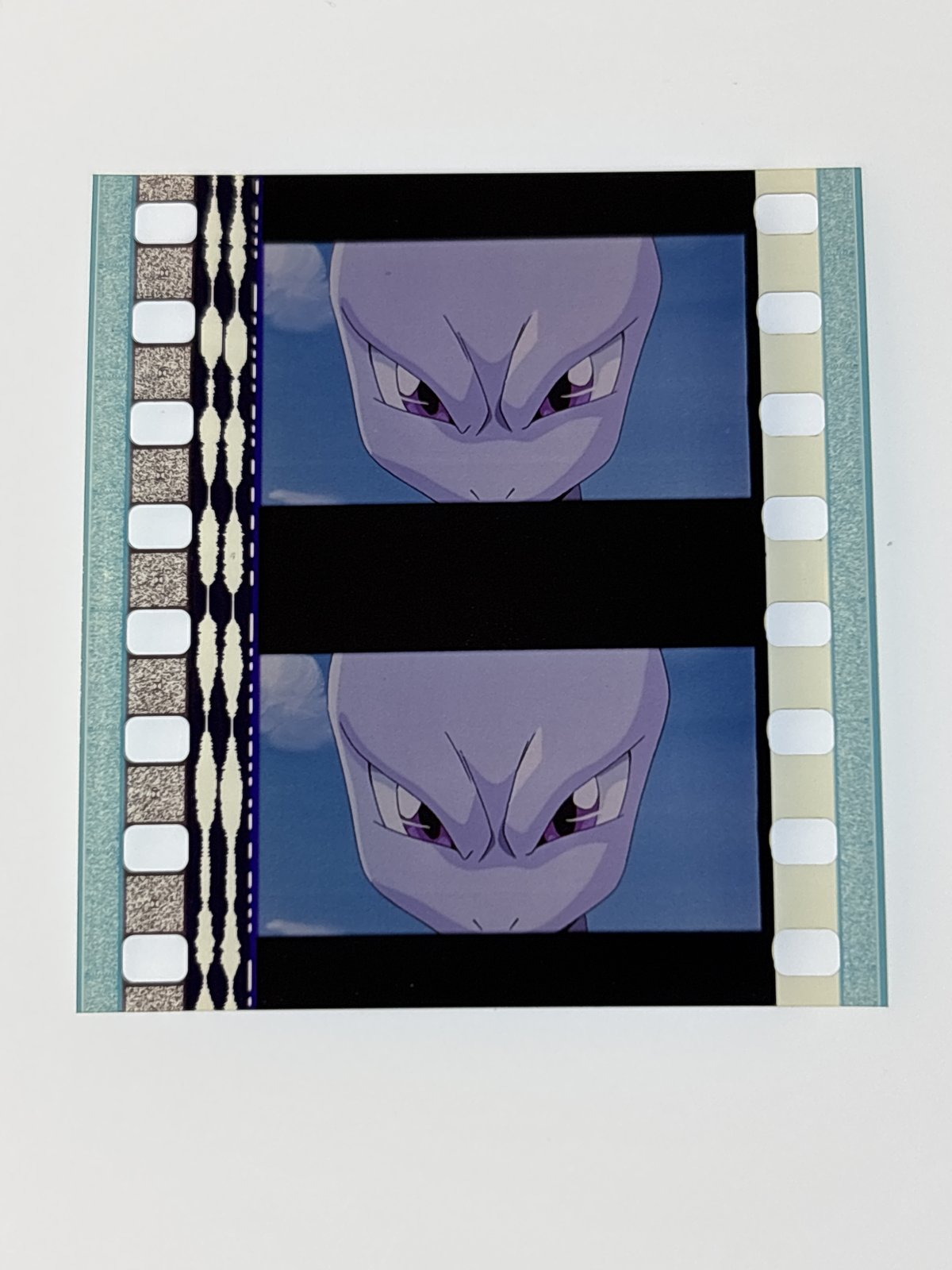 The film strip as photographed on the light panel at intake, before encapsulation