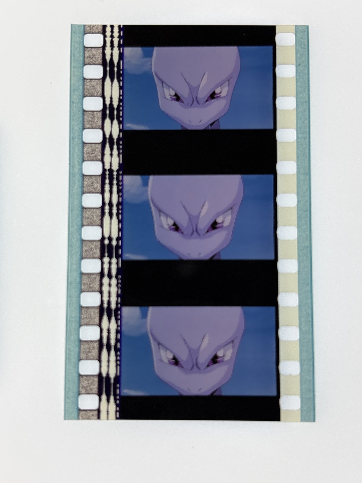 The film strip as photographed on the light panel at intake, before encapsulation