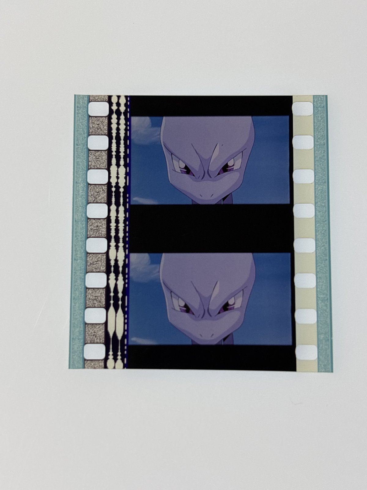 The film strip as photographed on the light panel at intake, before encapsulation