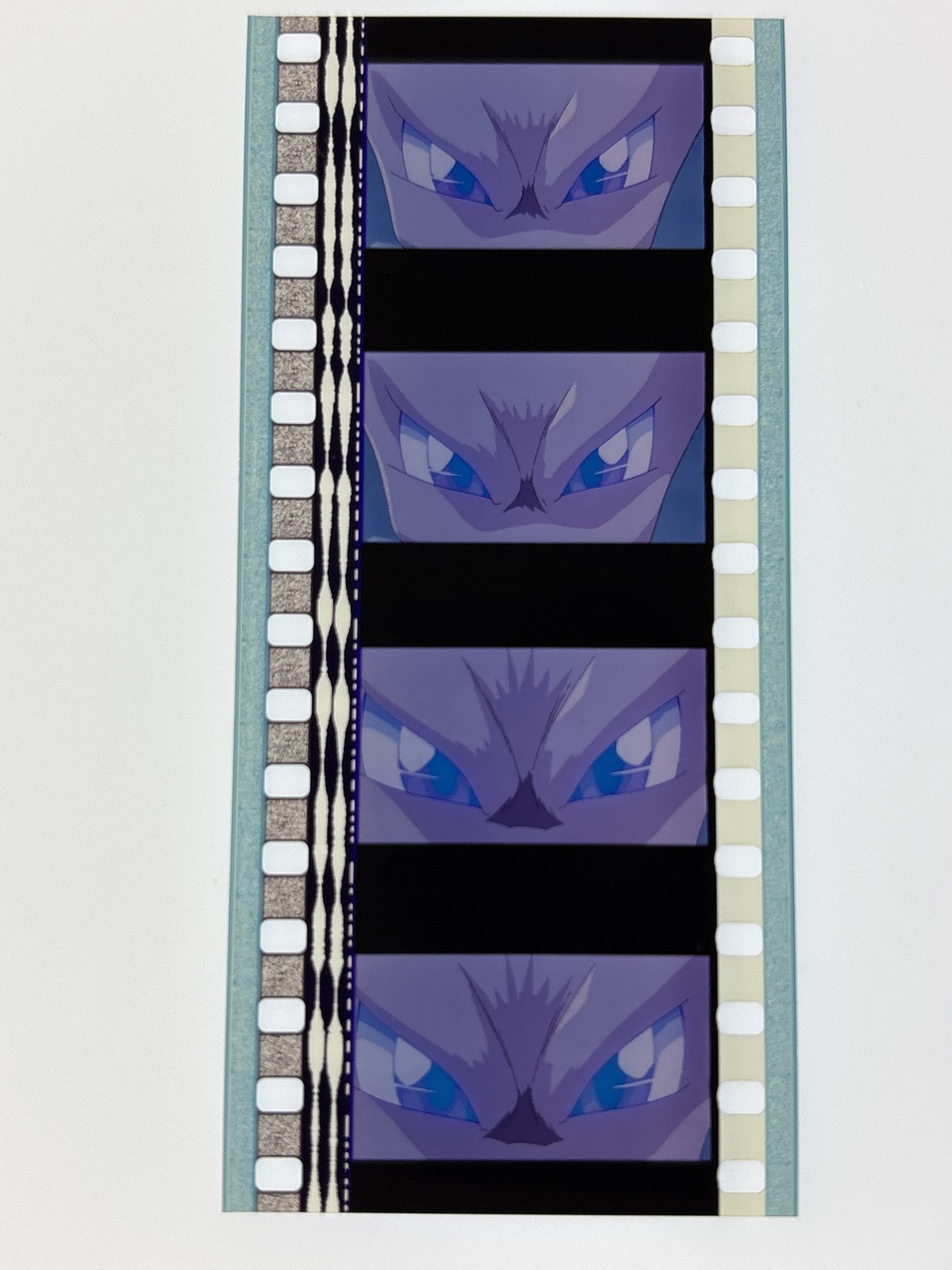 The film strip as photographed on the light panel at intake, before encapsulation