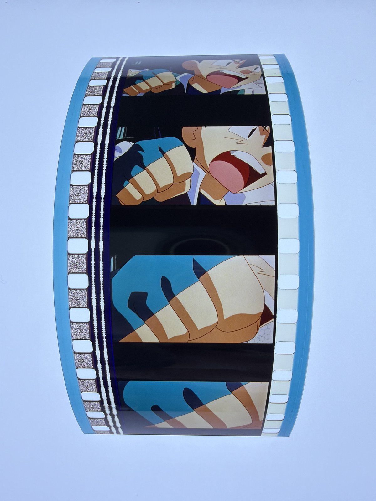 The film strip as photographed on the light panel at intake, before encapsulation