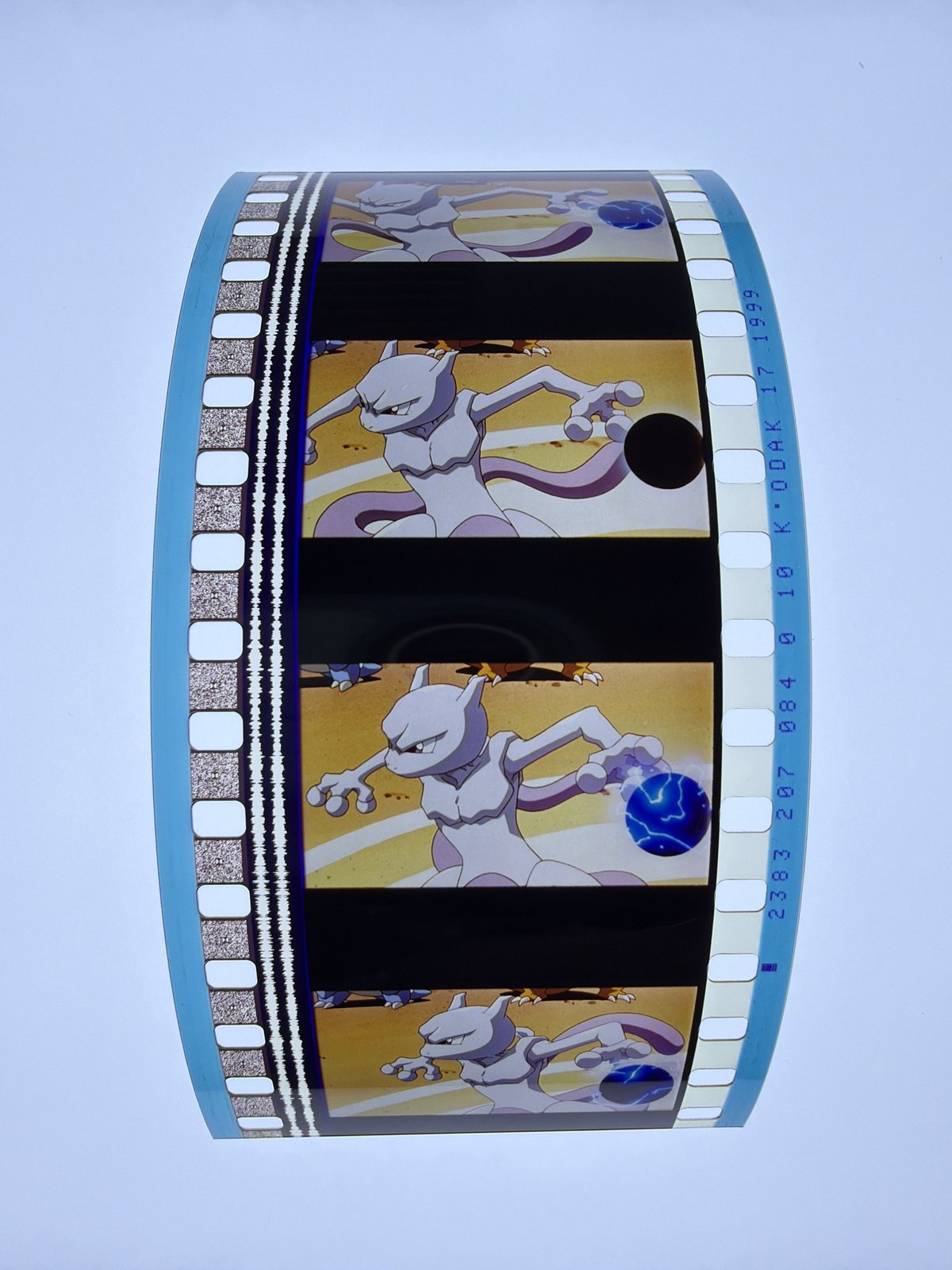 The film strip as photographed on the light panel at intake, before encapsulation