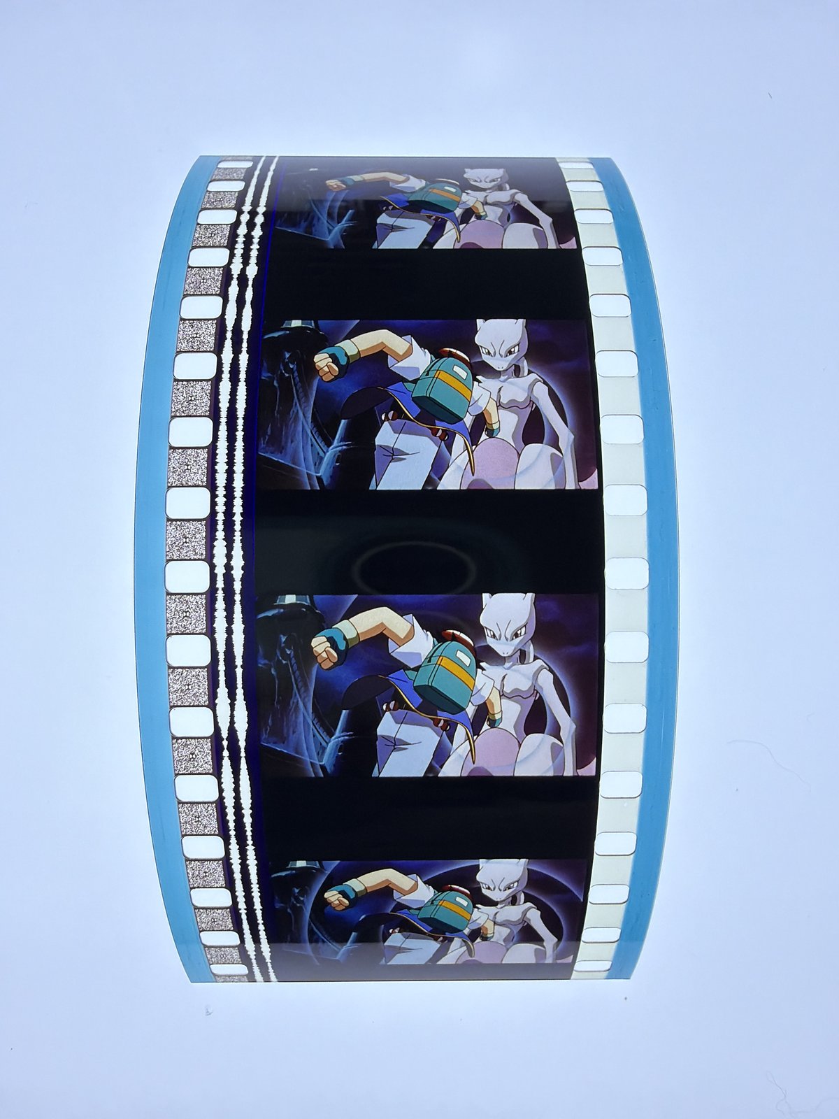 The film strip as photographed on the light panel at intake, before encapsulation