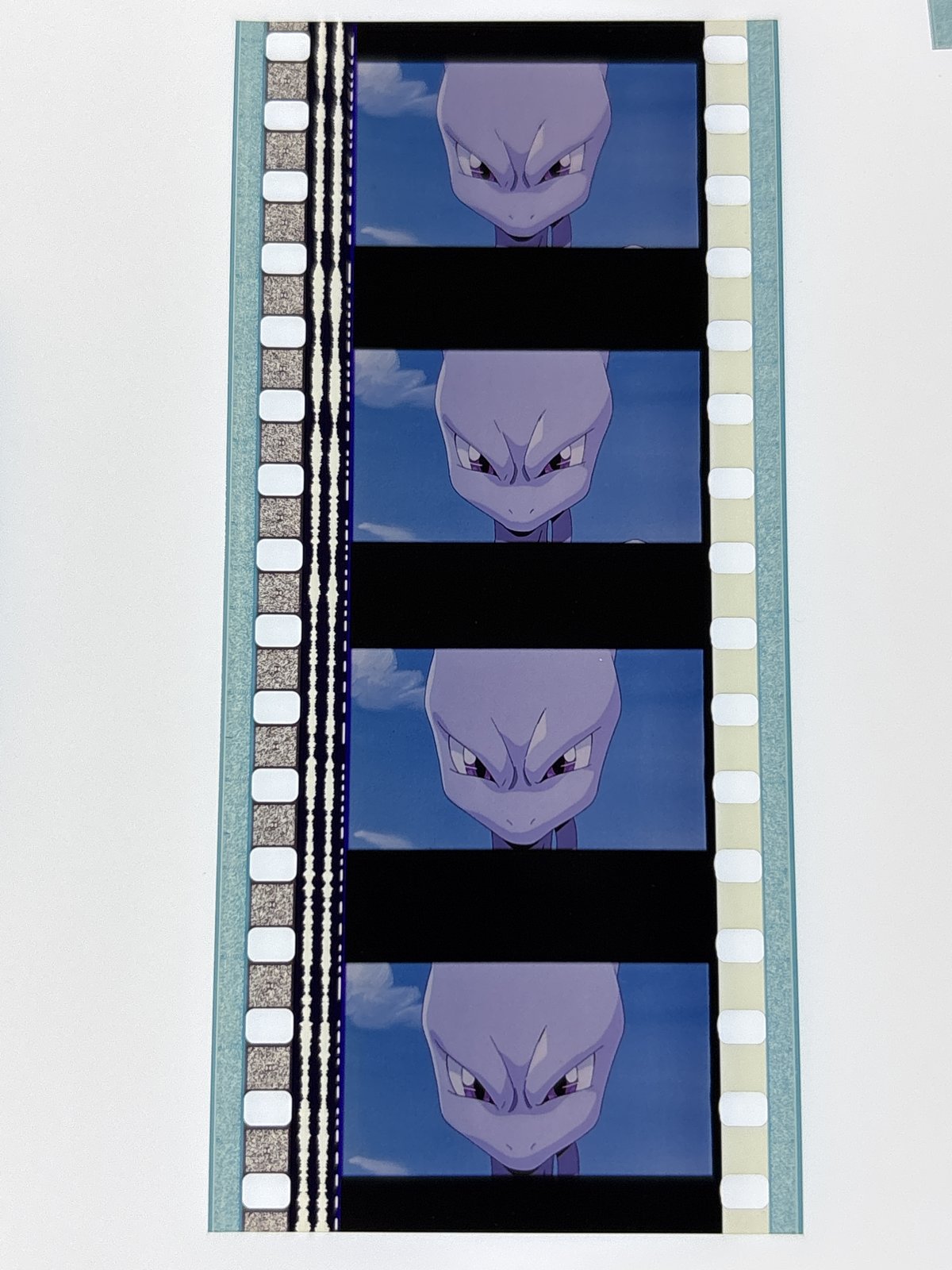 The film strip as photographed on the light panel at intake, before encapsulation