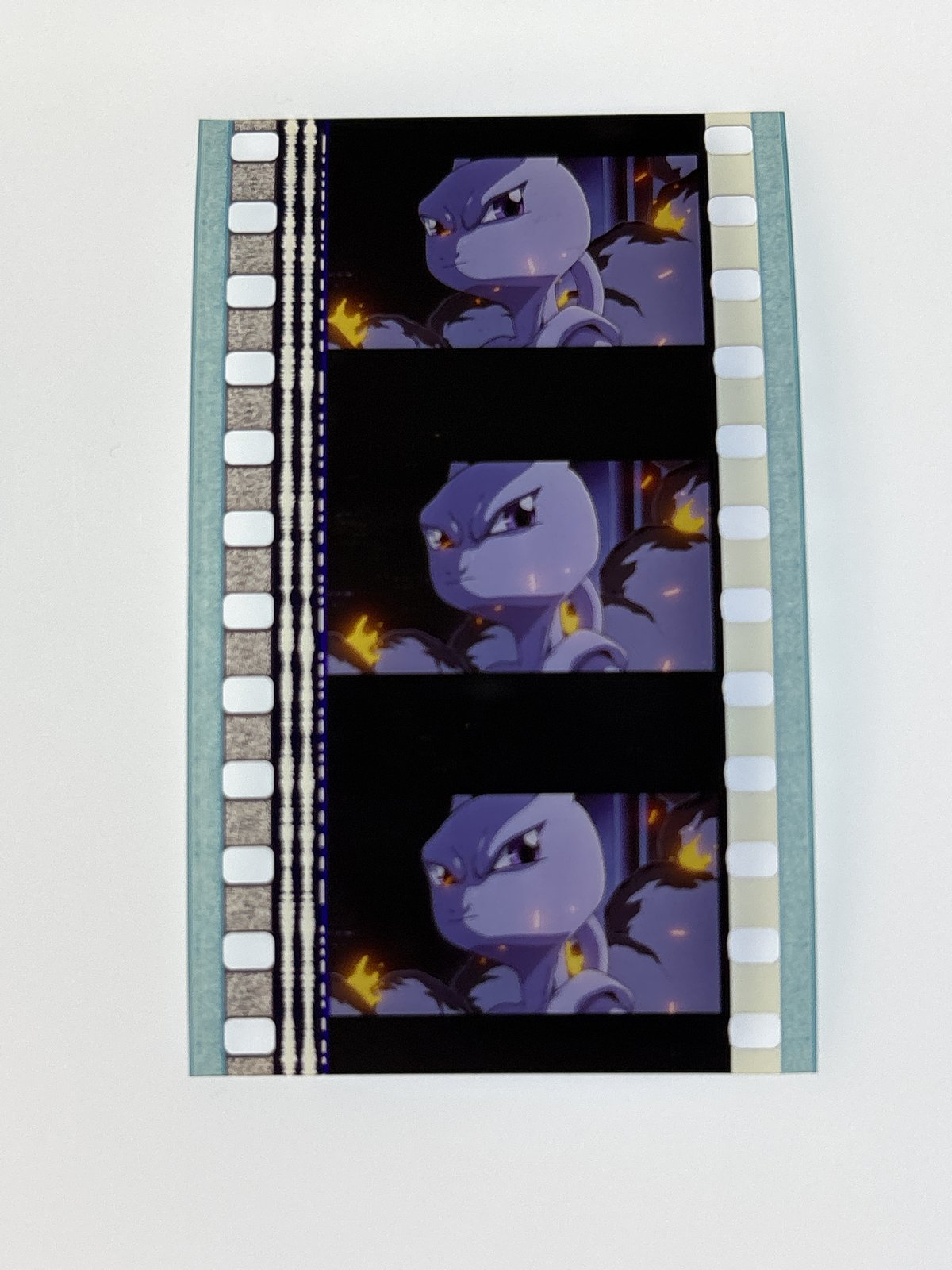 The film strip as photographed on the light panel at intake, before encapsulation