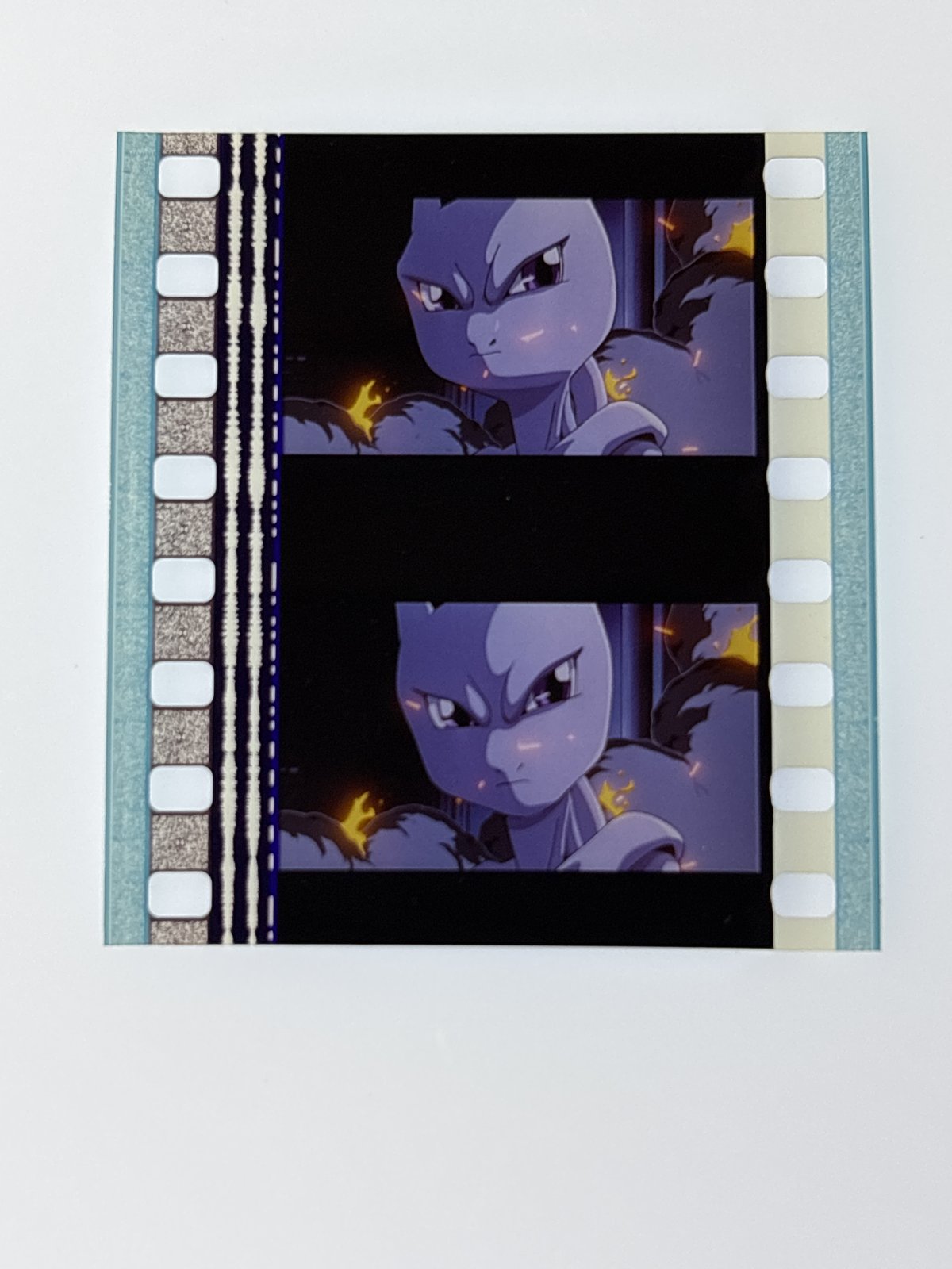 The film strip as photographed on the light panel at intake, before encapsulation
