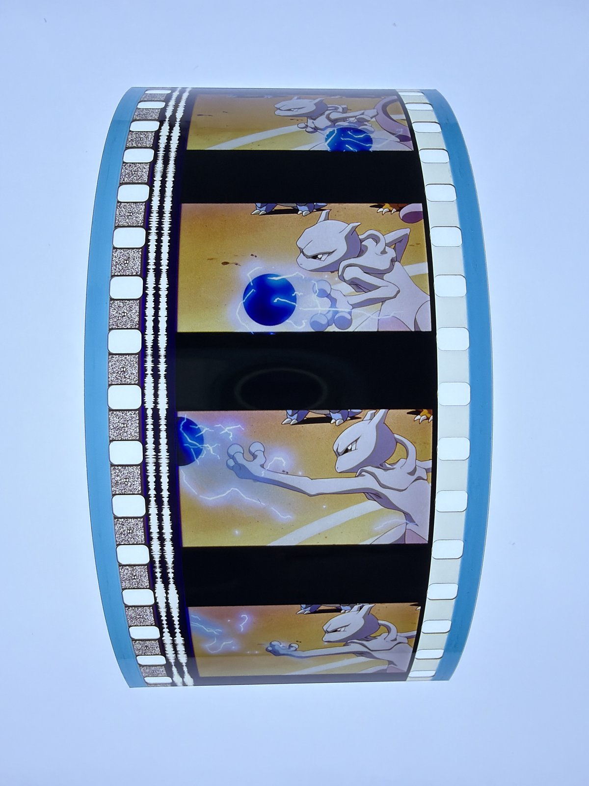 The film strip as photographed on the light panel at intake, before encapsulation