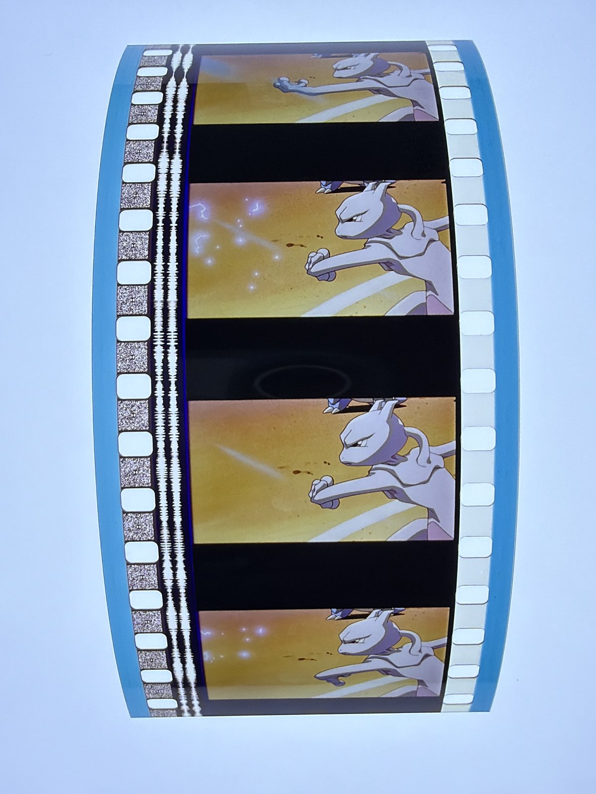 The film strip as photographed on the light panel at intake, before encapsulation