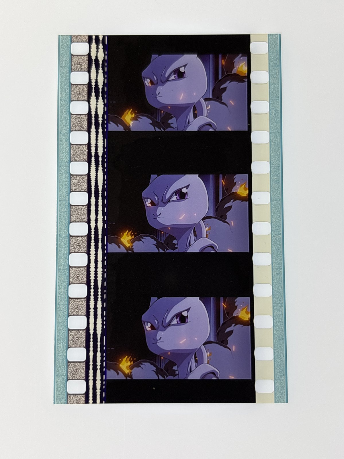 The film strip as photographed on the light panel at intake, before encapsulation