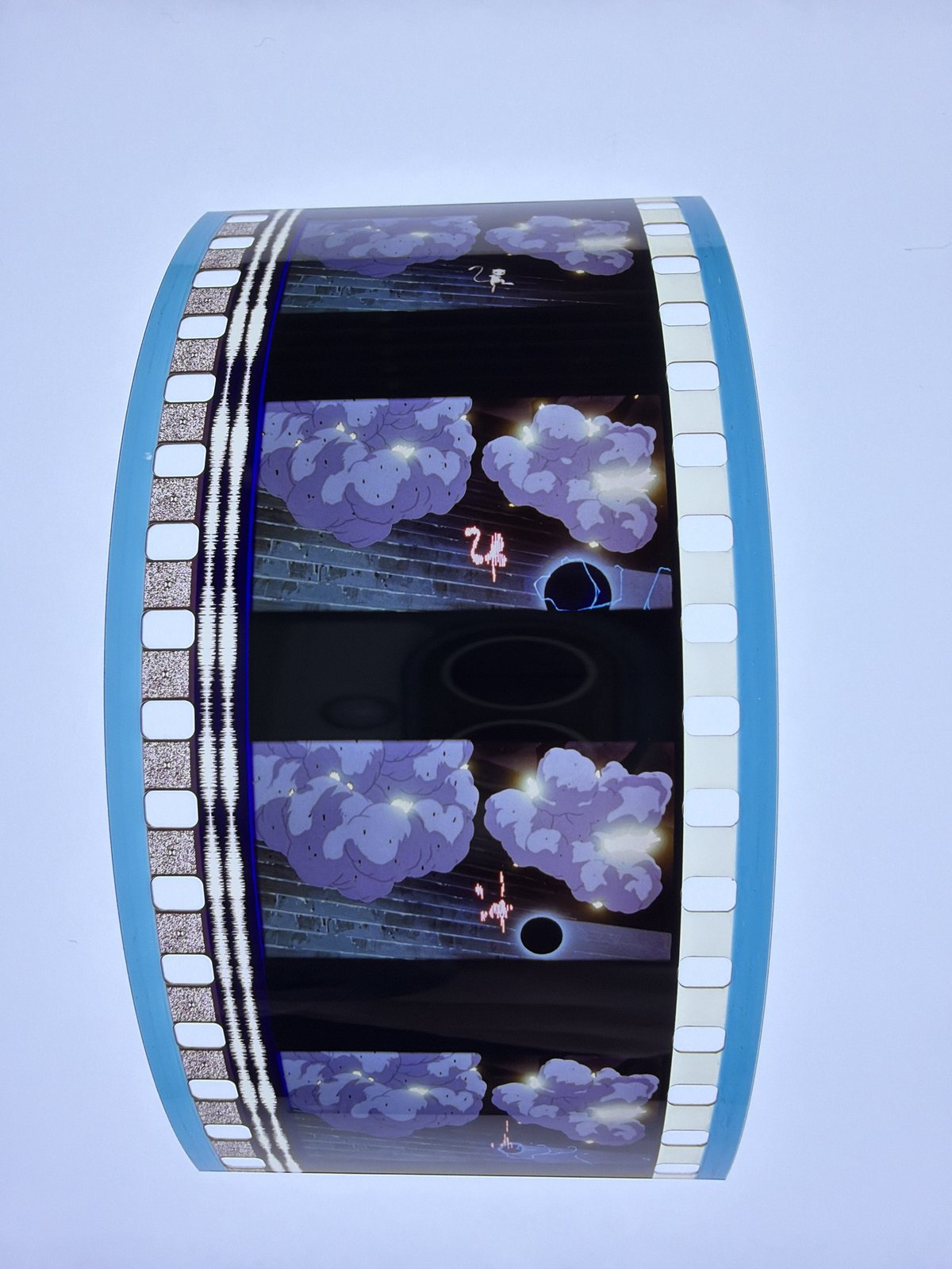 The film strip as photographed on the light panel at intake, before encapsulation
