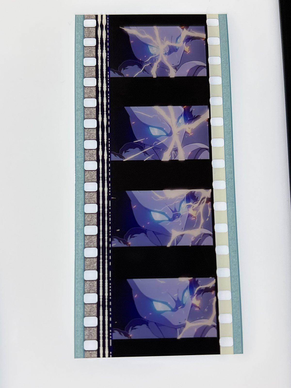 The film strip as photographed on the light panel at intake, before encapsulation