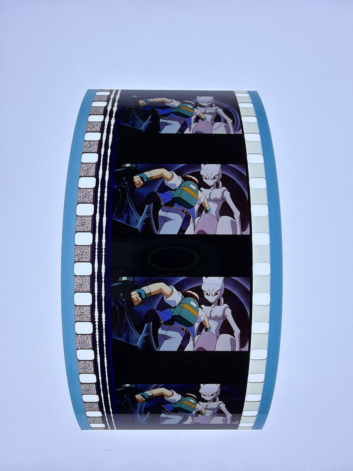 The film strip as photographed on the light panel at intake, before encapsulation