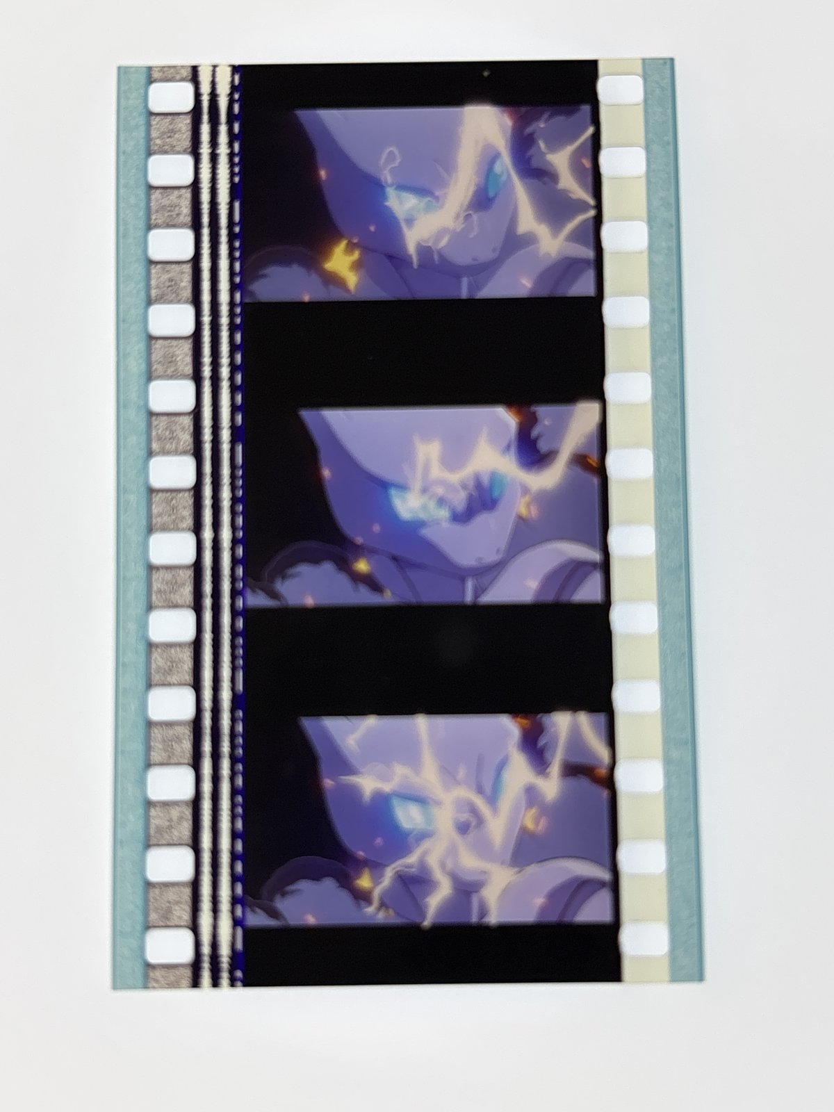 The film strip as photographed on the light panel at intake, before encapsulation