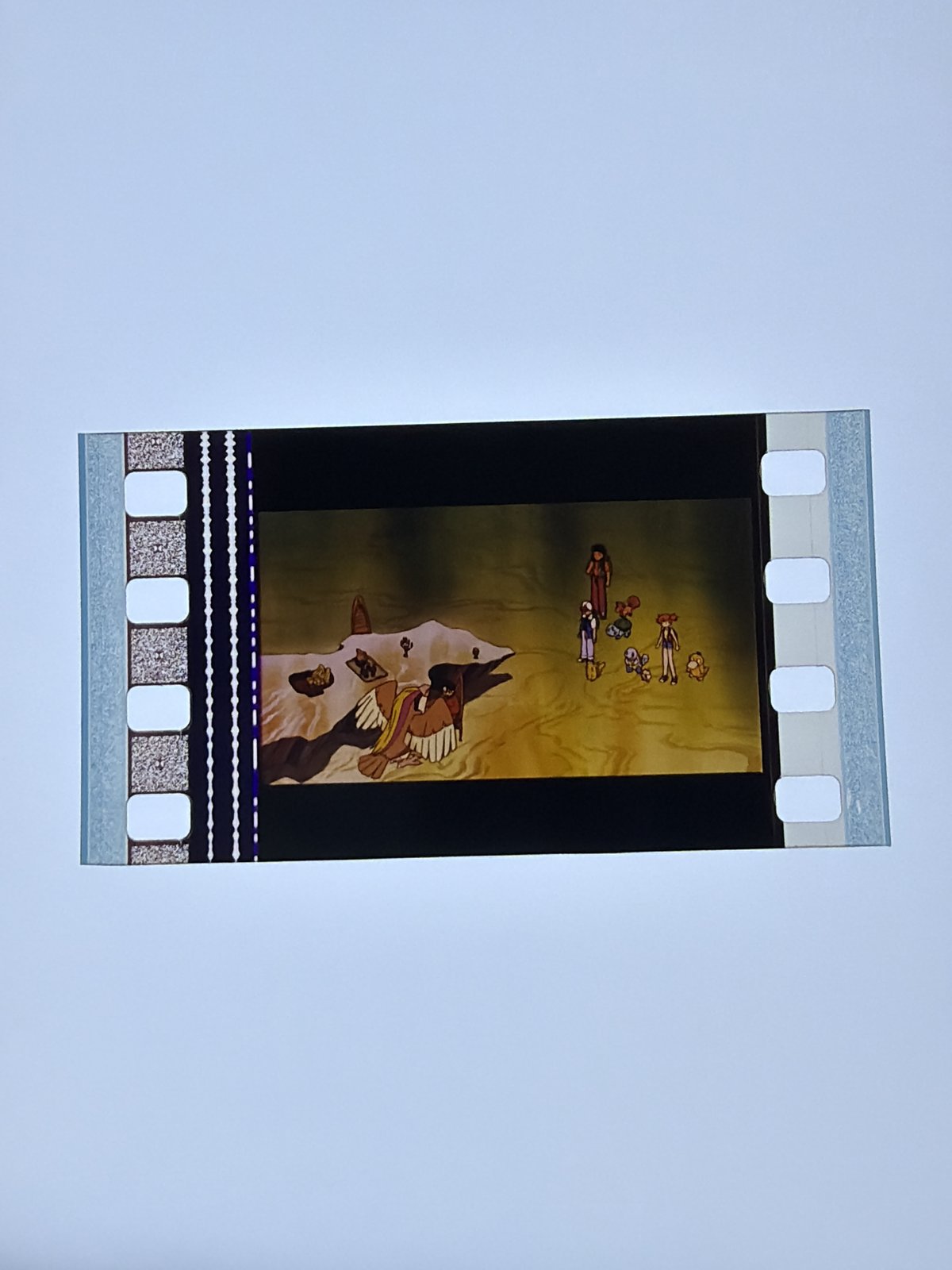 The film strip as photographed on the light panel at intake, before encapsulation