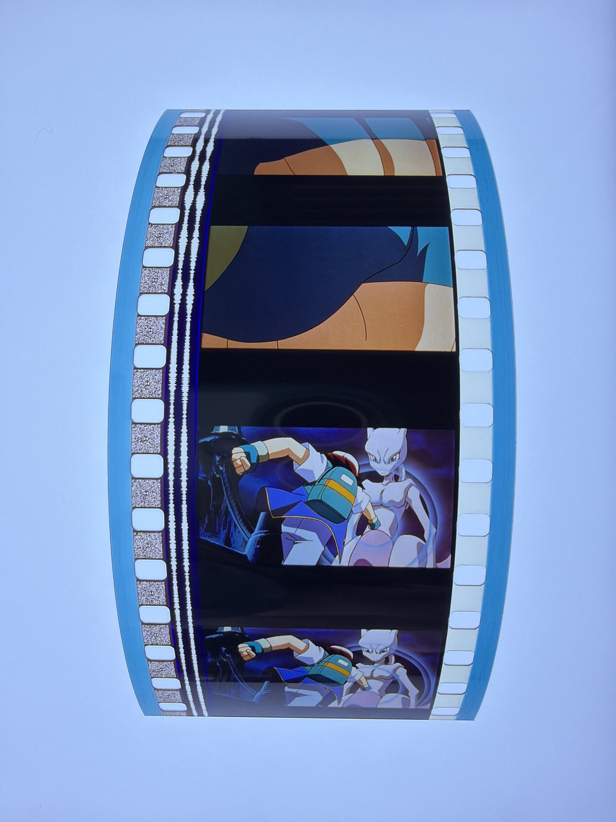 The film strip as photographed on the light panel at intake, before encapsulation