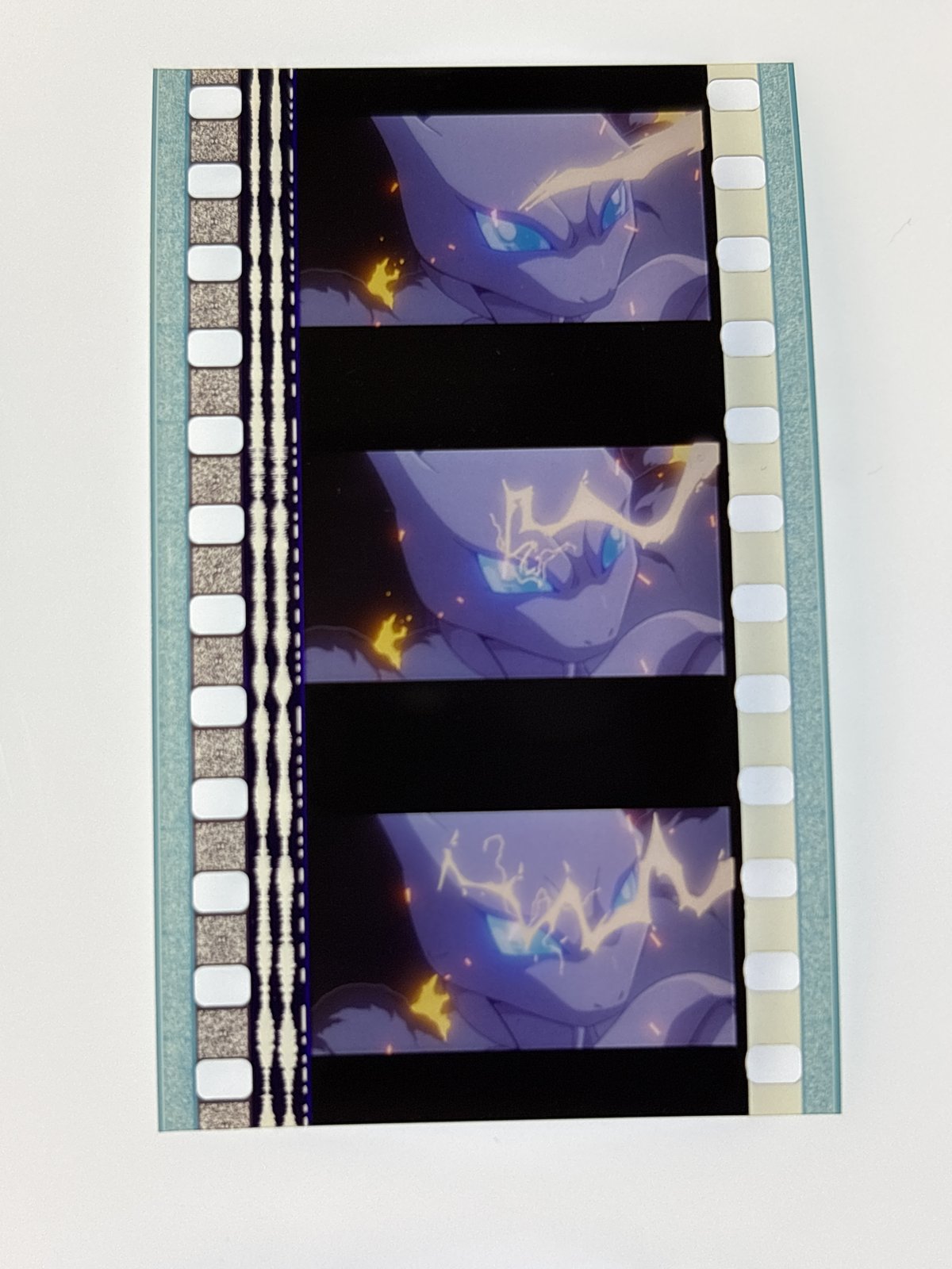 The film strip as photographed on the light panel at intake, before encapsulation
